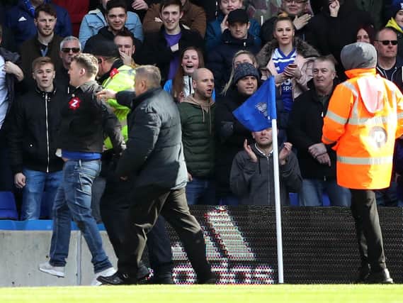 Paul Mitchell (left, on pitch, blue jeans) has been jailed for 14 weeks after attacking Aston Villa captain Jack Grealish. Picture : Nick Potts/PA Wire