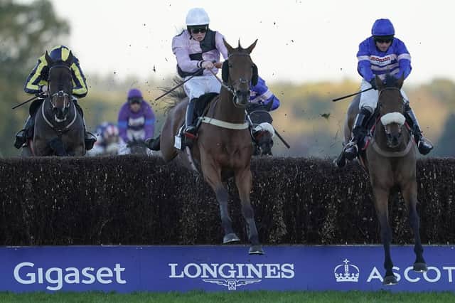 Josh Moore and Traffic Fluide, centre, clear the last to win the Sodexo Gold Cup Handicap Chase at Ascot in November