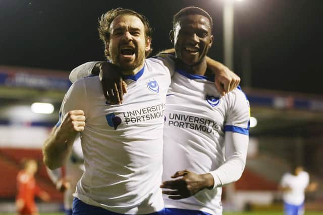 Brett Pitman, left, celebrates his opener at Walsall with Viv Solomon-Otabor. Picture: Joe Pepler