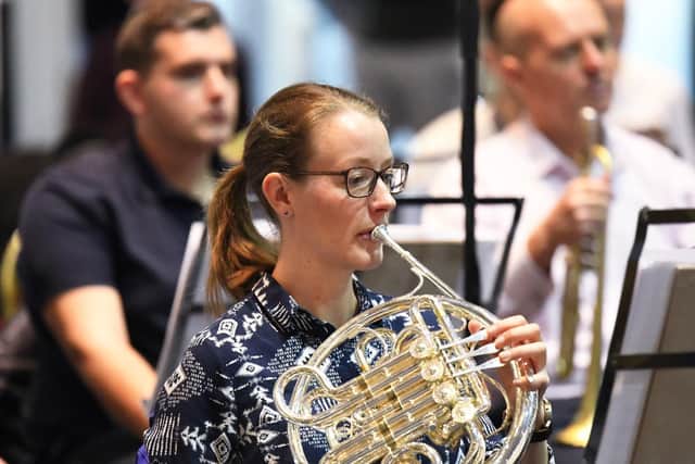 Musician Charlotte Briggs on the French Horn. Picture by: Malcolm Wells (190313-4289)