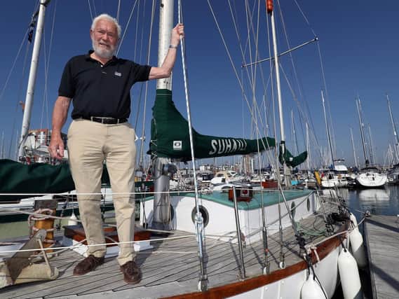 Sir Robin Knox-Johnston stands on the deck of his boat Suhaili on which he became the first person to sail non-stop around the world. Picture: Andrew Matthews/PA Wire