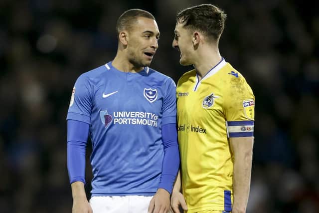 James Vaughan, seen here confronting Bristol Rovers' Tom Lockyer, is struggling with a back problem. Picture: Robin Jones/Digital South