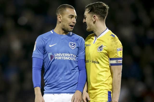 James Vaughan, seen here confronting Bristol Rovers' Tom Lockyer, is struggling with a back problem. Picture: Robin Jones/Digital South