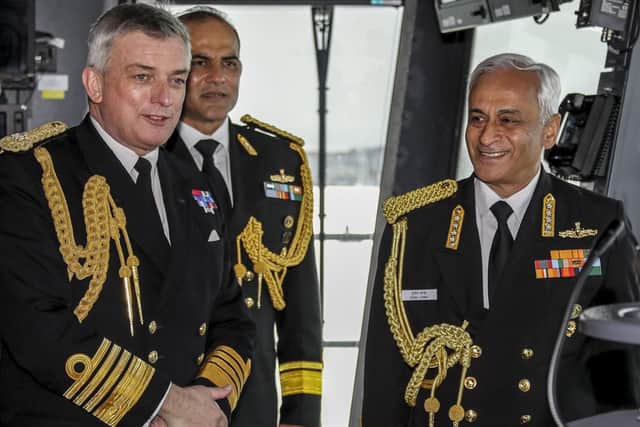 Pictured: The Chief of the Indian Naval Staff Admiral Sunil Lanba and The Chief of Naval Staff, The First Sea Lord Admiral Sir Philip Jones on the bridge of HMS Queen Elizabeth. Photo: LPhot Barry Swainsbury