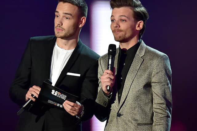 Louis Tomlinson (right) sister has suddenly died aged 18, pictured with former One Direction bandmate Liam Payne (left). Pictue: Dominic Lipinski/PA Wire