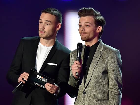 Louis Tomlinson (right) sister has suddenly died aged 18, pictured with former One Direction bandmate Liam Payne (left). Pictue: Dominic Lipinski/PA Wire