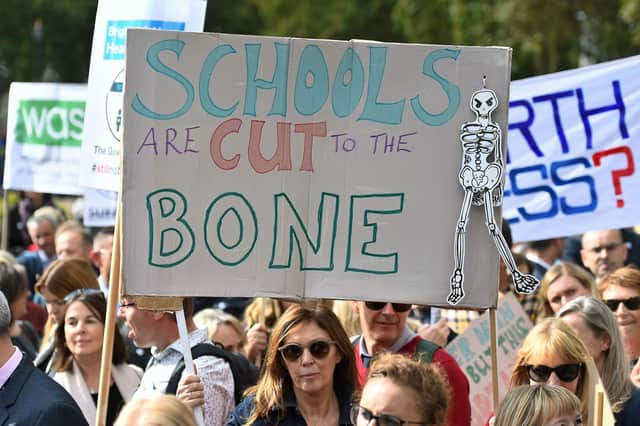 Headteachers from across England and Wales hold signs in Parliament Square, London, as they prepare to march on Downing Street to demand extra cash for schools. PRESS ASSOCIATION Photo. Picture date: Friday September 28, 2018. See PA story EDUCATION Headteachers. Photo credit should read: Kirsty O'Connor/PA Wire