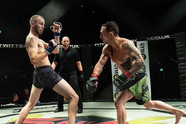 Charlie Riccard, left, fights for the Shock N Awe amateur featherweight title today. Picture: Vernon Nash (180686-005)