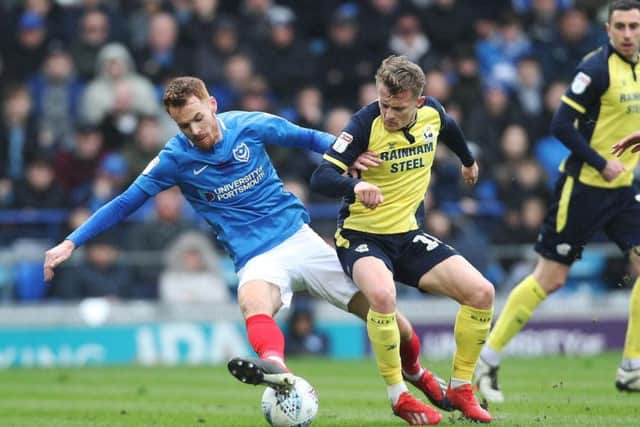 Tom Naylor in action against Scunthorpe in a game that kept Pompey on the tails of the top three / Picture: Joe Pepler