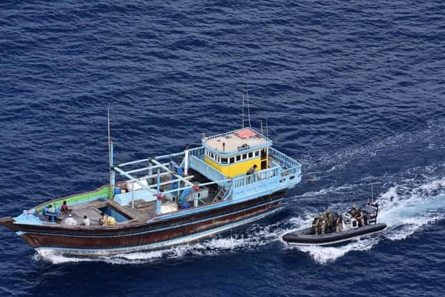 Dragon's boarding party approaches the fishing vessel packed with 2,540Kg of hash.