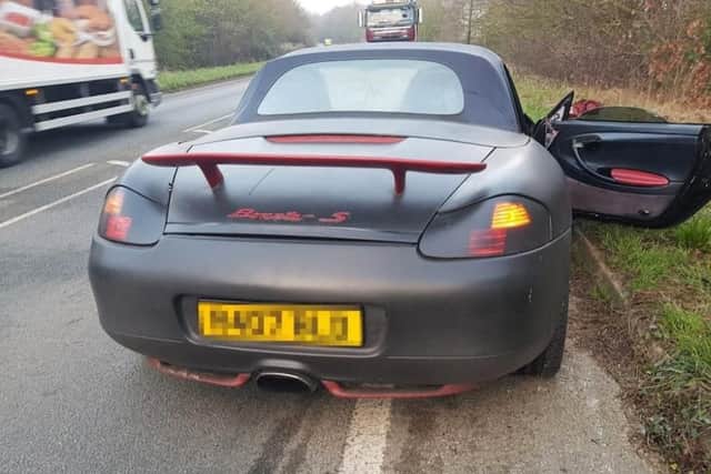 A Porsche that was abandoned after the driver fled the scene of a crash in Wick, West Sussex. Picture: Sussex Police/PA Wire