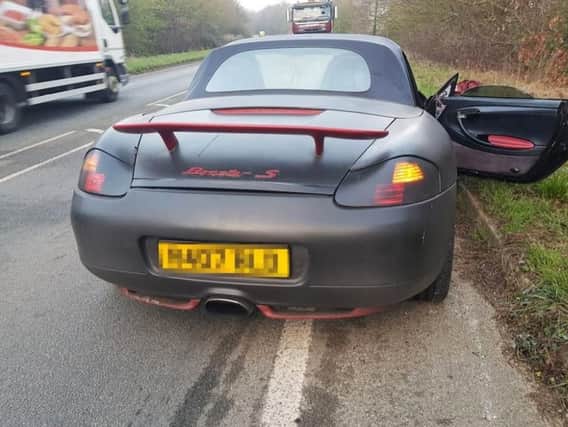 A Porsche that was abandoned after the driver fled the scene of a crash in Wick, West Sussex. Picture: Sussex Police/PA Wire