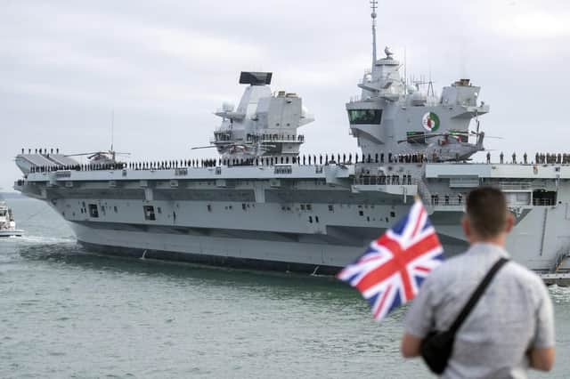 At risk? Admiral Lord Alan West fears both Queen Elizabeth-class carriers could be at risk if Britain does not sort out a 7bn hole in its defence budget. Pictured is HMS Queen Elizabeth leaving Portsmouth Harbour on her maiden trip to America. Photo: Steve Parsons/PA Wire