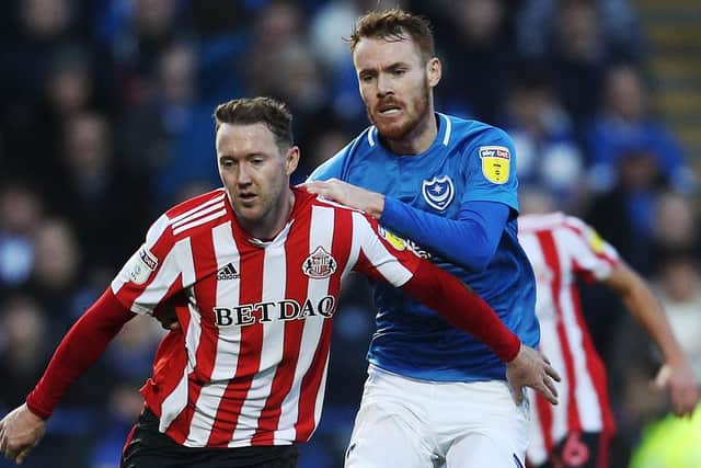 Tom Naylor battles Aidan McGeady for the ball during Pompey's win over Sunderland in December. Picture: Joe Pepler
