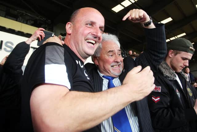 Iain McInnes, right, celebrates Pompey's promotion from League Two with manager Paul Cook