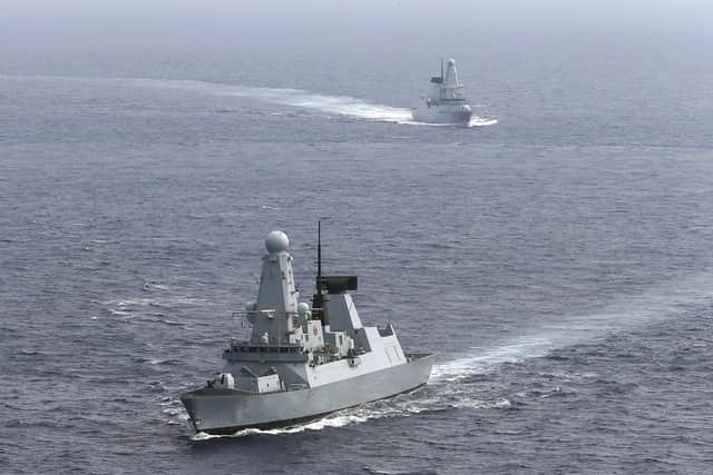 Pictured: HMS DUNCAN leads the way for HMS DRAGON, as both ships prepare for a sail past. Photo: LPhot Ben Corbett.