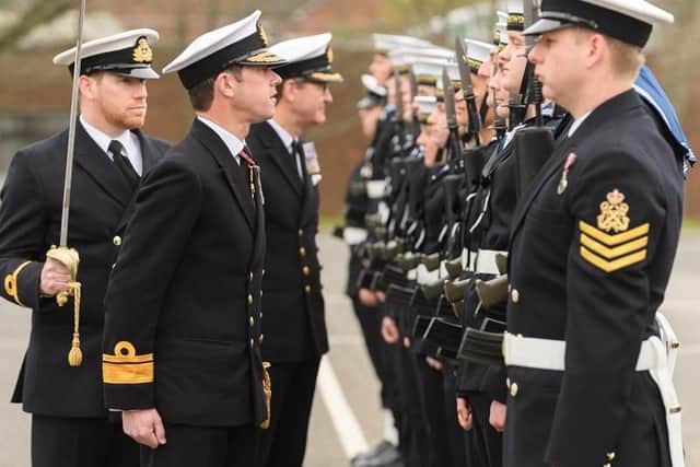 Rear Admiral Will Warrender, flag officer sea training, inspected the ceremonial guard at HMS Collingwood. Photo: Keith Woodland