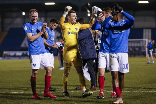 Pompey keeper Craig MacGillivray, centre