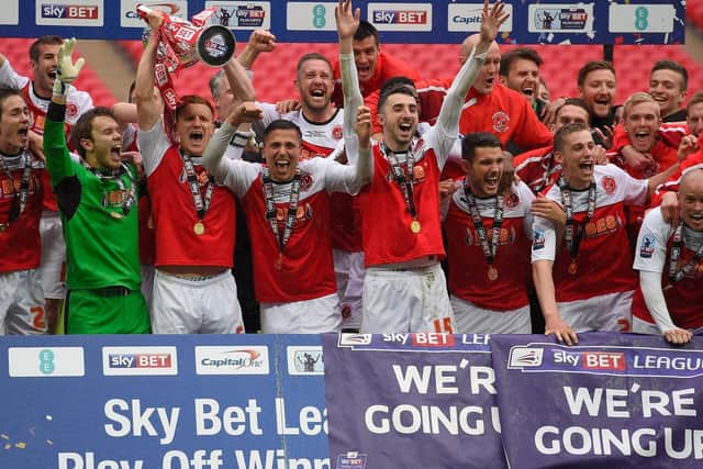 Gareth Evans, front row, third from right, celebrates promotion at Wembley with his Fleetwood team-mates in 2014 Picture: Mike Hewitt/Getty Images