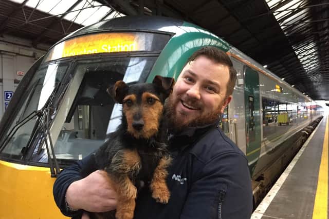 Irish rail worker Ted Maher with intrepid travelling dog 'Hamish', who boarded a commuter train in Co Kildare and ended up at Dublin's Heuston Station. Picture: David Young/PA Wire