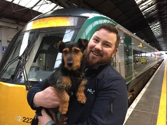 Irish rail worker Ted Maher with intrepid travelling dog 'Hamish', who boarded a commuter train in Co Kildare and ended up at Dublin's Heuston Station. Picture: David Young/PA Wire