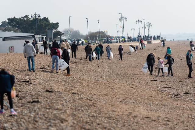 The beach cleaners go hunting for rubbish. Picture: Vernon Nash (060419-007)