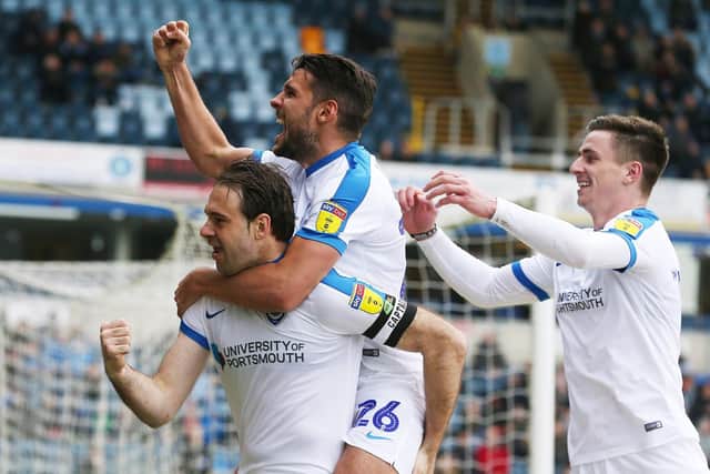 Brett Pitman, Gareth Evans and Oli Hawkins celebrate. Picture: Joe Pepler