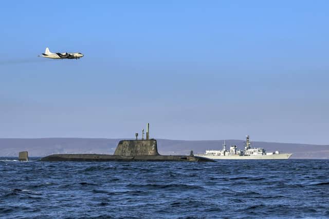 An Astute-class nuclear submarine in company of Portsmouth-based Type 23 frigate HMS Kent while a German Navy P3 maritime patrol aircraft flies overhead. Photo: Royal Navy