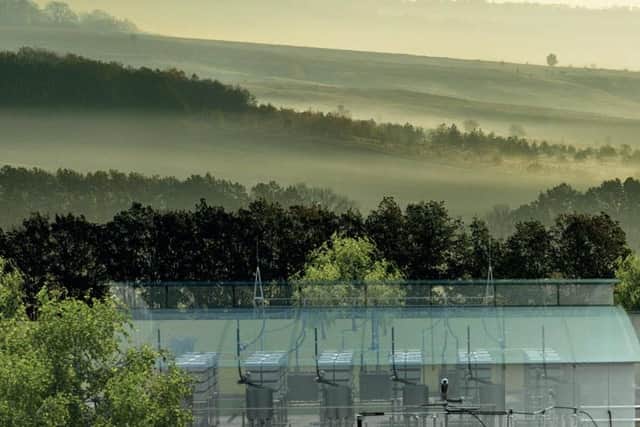 A computer-generated image of the Aquind Interconnector - with a backdrop of the rolling plains of the South Downs