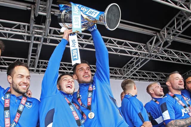 Conor Chaplin, left, and Gareth Evans celebrate Pompey's League Two title triumph. Picture: Joe Pepler