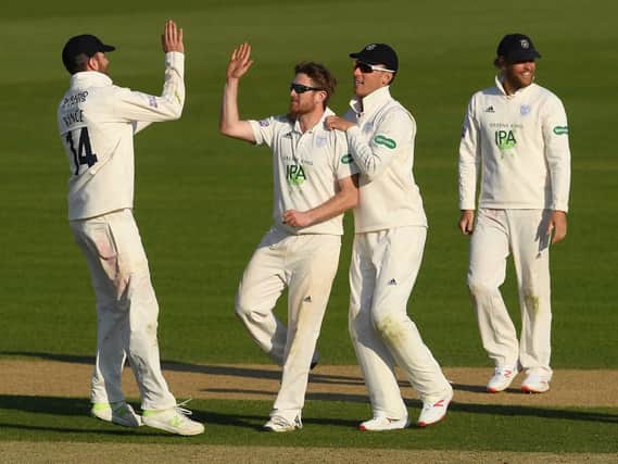 Liam Dawson celebrates bowling Joe Root against Hampshire. Picture: Mike Hewitt/Getty Images