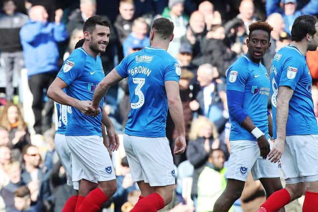 Pompey celebrate Gareth Evans' goal in their win over Rochdale. Picture: Joe Pepler