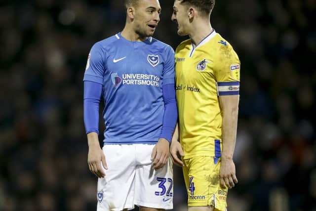 James Vaughan exchanges words with Bristol Rovers' Tom Lockyer during a rare Pompey outing. Picture: Robin Jones/Digital South