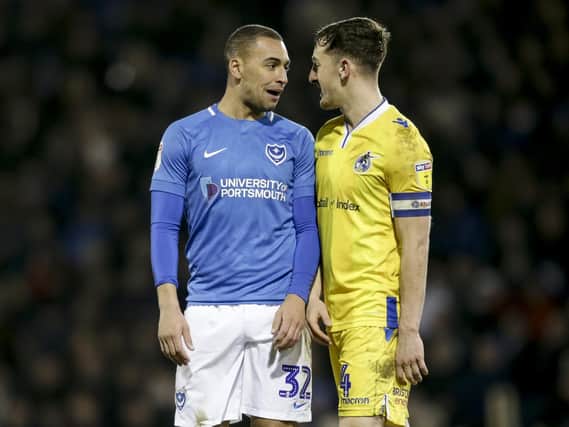 James Vaughan exchanges words with Bristol Rovers' Tom Lockyer during a rare Pompey outing. Picture: Robin Jones/Digital South