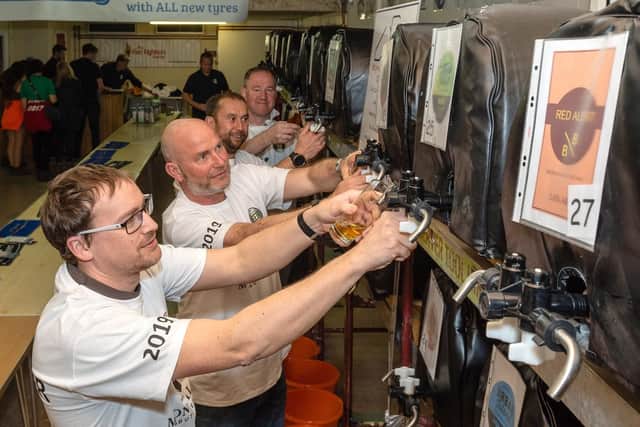 Volunteers pulling pints at the Wickham Charity Beer Festival. Picture: Vernon Nash.