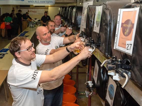 Volunteers pulling pints at the Wickham Charity Beer Festival. Picture: Vernon Nash.
