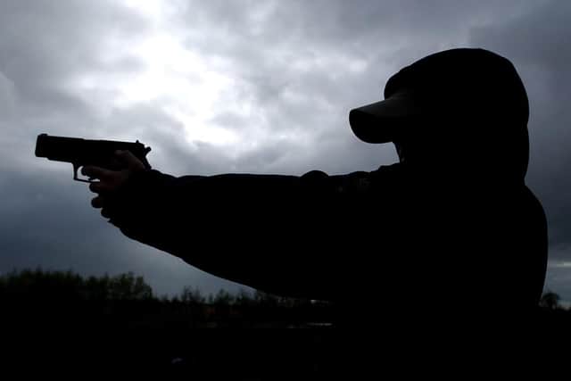POSED BY MODEL - silhouette
Youth teenager with a BB gun airgun