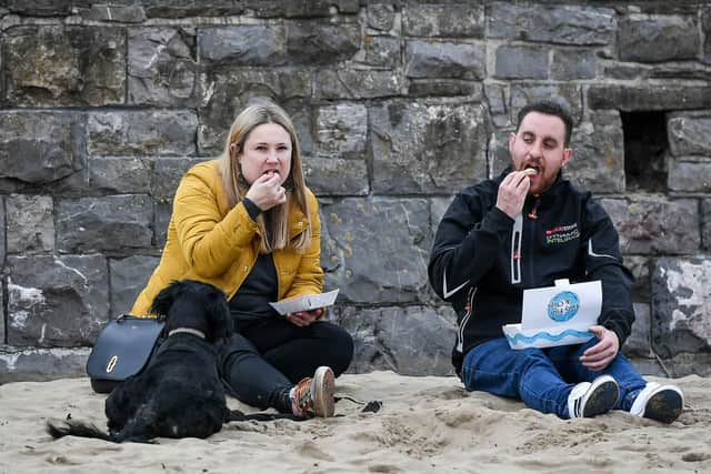 People eat fish and chips. Picture: Ben Birchall/PA Wire