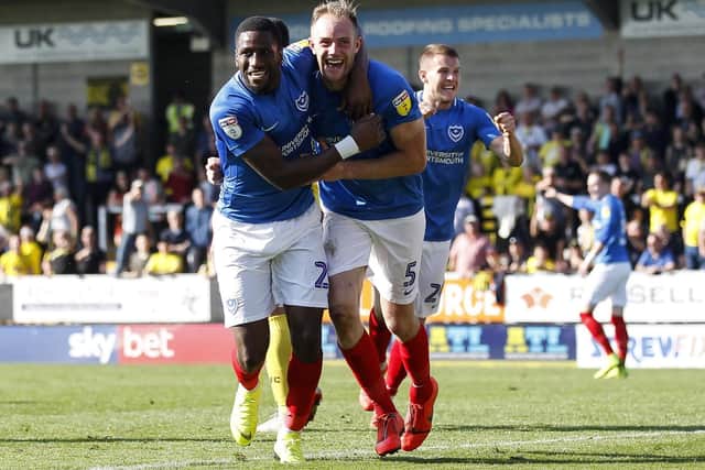 Matthew Clarke of Portsmouth celebrates with Omar Bogle of Portsmouth after the late winner yesterday. (Photo by Daniel Chesterton/phcimages.com)