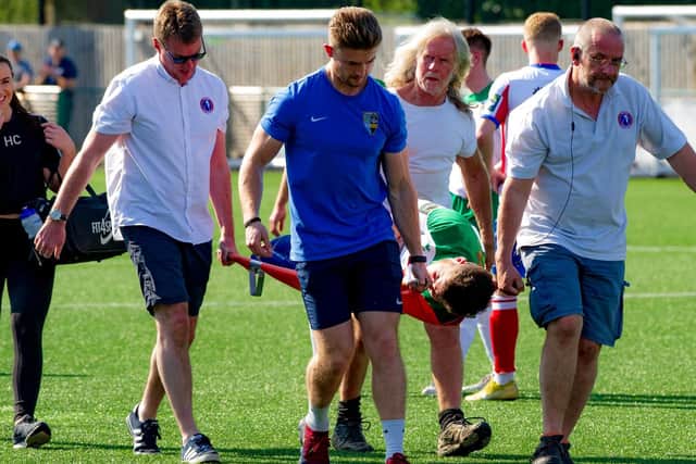 Bradley Lethbridge is stretchered off during Bognor's defeat at Dorking Wanderers. Picture: Tommy McMillan