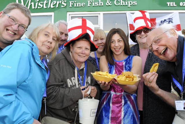 Co-owner of Whistler's, Rana Denholm, third-right, with happy customers and volunteers at a previous St George's Day event. Picture; Malcolm Wells