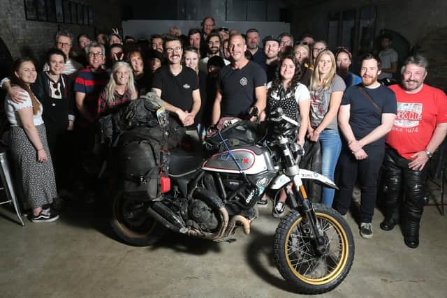 Henry Crew (centre) is joined by friends and family as he returns home to the UK. Photo: Isabel Infantes/PA Wire