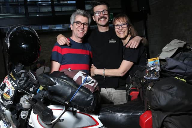 Henry Crew (centre) is greeted by his parents. Photo: Isabel Infantes/PA Wire