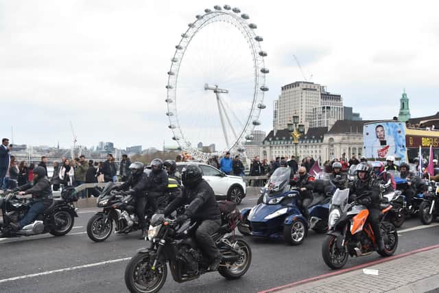 Motorcyclists take part in the Rolling Thunder ride protest cross Westminster Bridge in London, to support of Soldier F who is facing prosecution over Bloody Sunday. Photo: Kirsty O'Connor/PA Wire