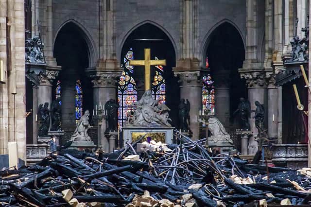 Debris are seen inside Notre Dame cathedral in Paris, Tuesday, April 16, 2019. (Christophe Petit Tesson, Pool via AP)