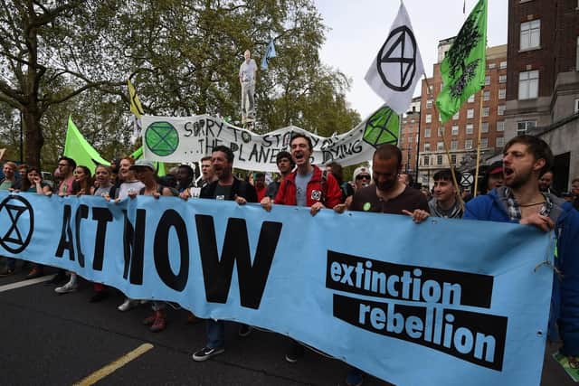 Extinction Rebellion protesters march down Park Lane in London. Picture: Kirsty O'Connor/PA Wire