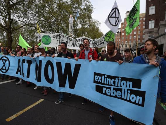 Extinction Rebellion protesters march down Park Lane in London. Picture: Kirsty O'Connor/PA Wire