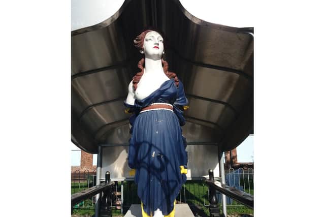 The wooden figurehead from Royal Navy ship HMS Arethusa. Photo: Historic England/PA Wire