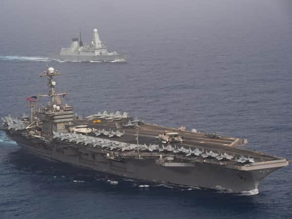 HMS Duncan behind the aircraft carrier USS John C. Stennis in the Mediterranean this week Picture: US Navy Mass Communication Specialist 3rd Class Grant G. Grady