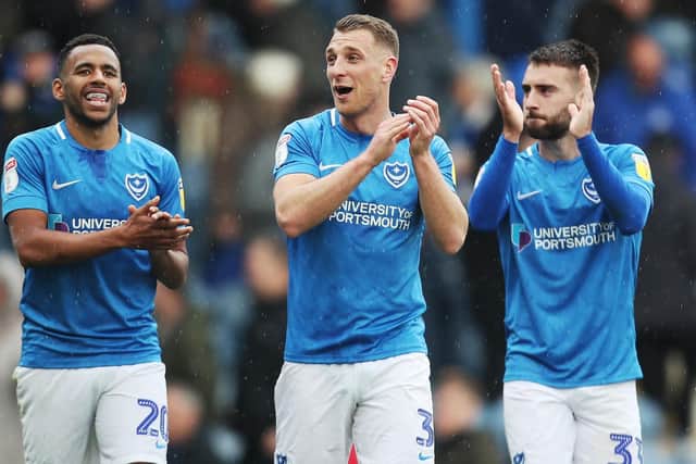 Lee Brown, centre, celebrates with Nathan Thompson, left, and Ben Close. Picture: Joe Pepler